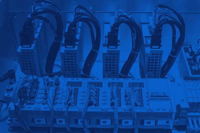 Rack of Allient servo drives and motion-control modules wired into industrial automation system.