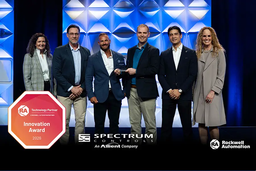People standing smiling because Spectrum Control (Allient Bellevue) team won the Rockwell Automation PartnerNetwork™ Innovation Award 202.